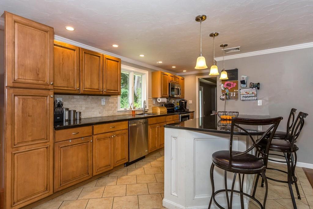 23 Wentworth Road Canton, MA 02021 - Photo 4 of 16 a kitchen with a sink cabinets and window