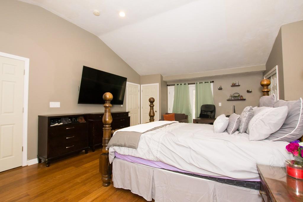 23 Wentworth Road Canton, MA 02021 - Photo 9 of 16 a bedroom with a bed and a flat tv screen on dresser