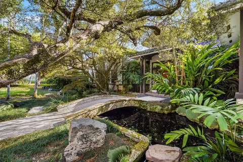 a view of an empty room with a staircase
