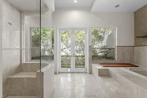 a bathroom with a bathtub and shower