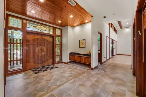 a view of a hallway with windows
