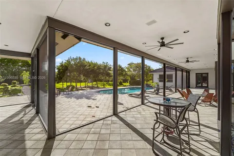 a view of a patio with swimming pool