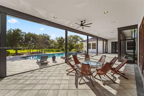 a view of a backyard with plants and a patio