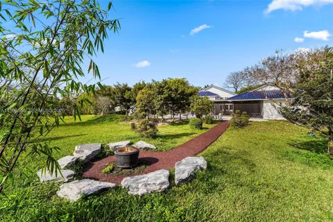 a view of a yard with an outdoor space