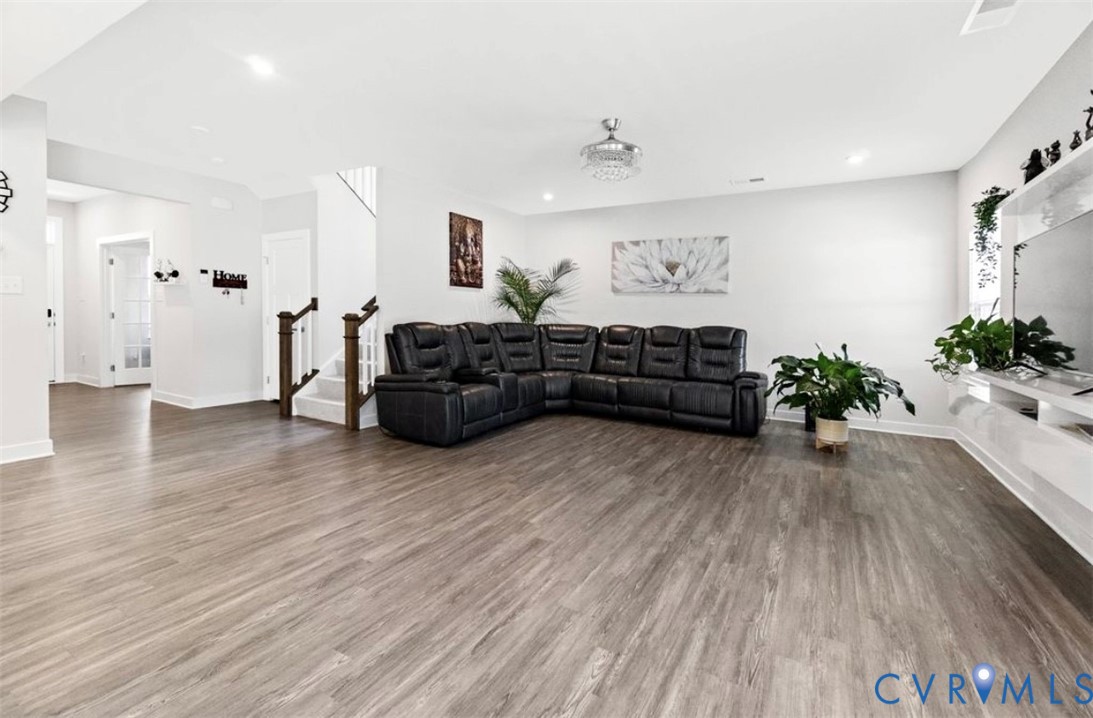 16043 Cambria Cove Boulevard Midlothian, VA 23112 - Photo 13 of 44 a living room with furniture and wooden floor