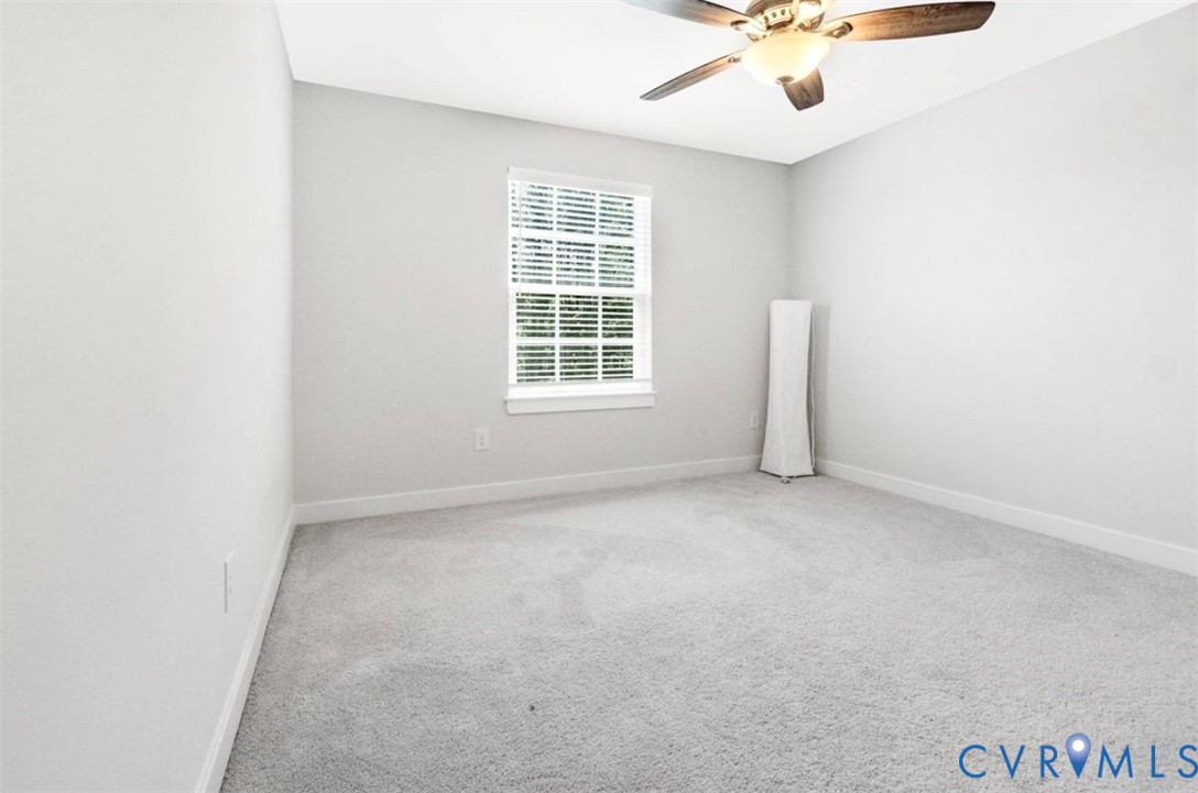 16043 Cambria Cove Boulevard Midlothian, VA 23112 - Photo 16 of 44 an empty room with a window and a ceiling fan