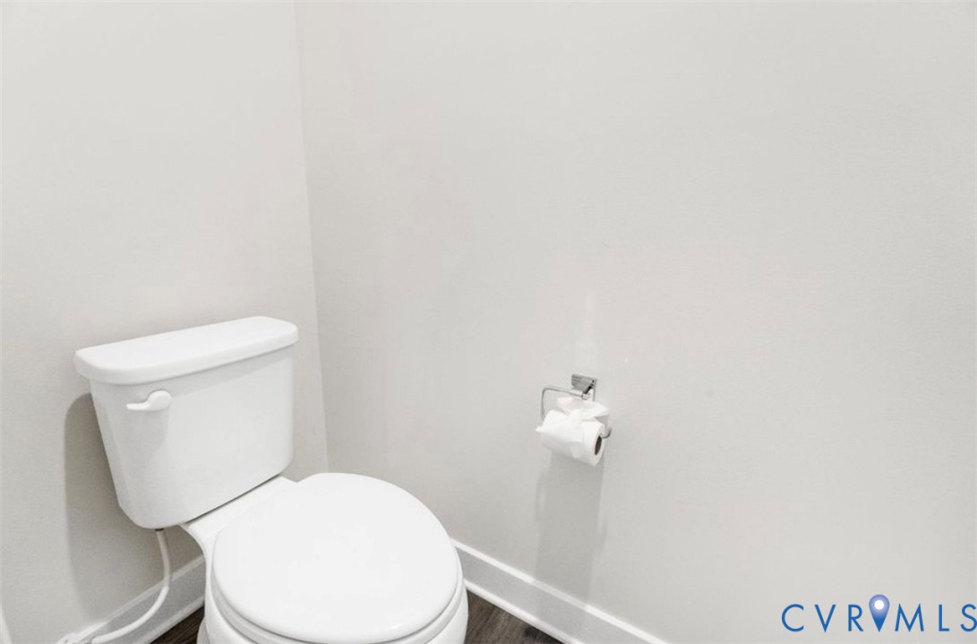 16043 Cambria Cove Boulevard Midlothian, VA 23112 - Photo 19 of 44 a white toilet sitting next to a shower
