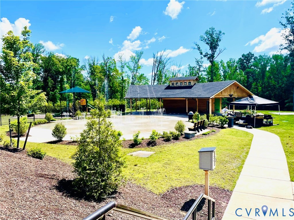 16043 Cambria Cove Boulevard Midlothian, VA 23112 - Photo 2 of 44 a view of swimming pool with outdoor seating and trees