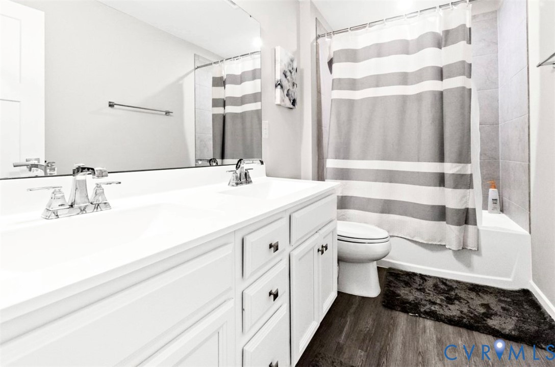16043 Cambria Cove Boulevard Midlothian, VA 23112 - Photo 25 of 44 a bathroom with a double vanity sink toilet and shower