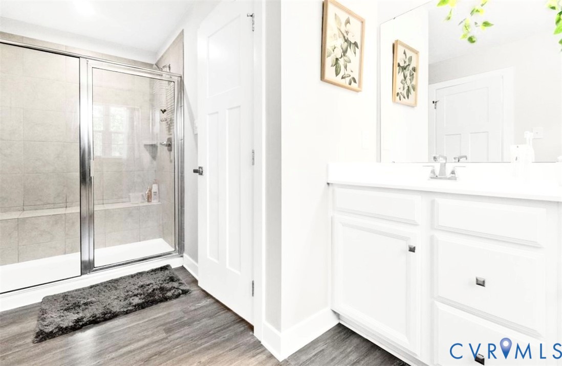16043 Cambria Cove Boulevard Midlothian, VA 23112 - Photo 26 of 44 a bathroom with a sink and a mirror