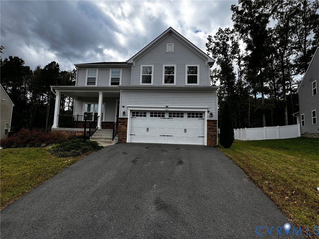 16043 Cambria Cove Boulevard Midlothian, VA 23112 - Photo 29 of 44 a view of a house with a yard covered with snow