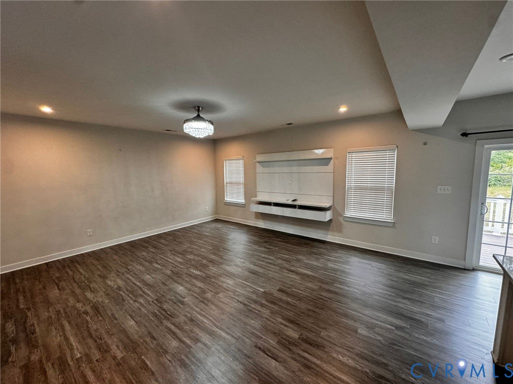 16043 Cambria Cove Boulevard Midlothian, VA 23112 - Photo 31 of 44 an empty room with wooden floor and windows