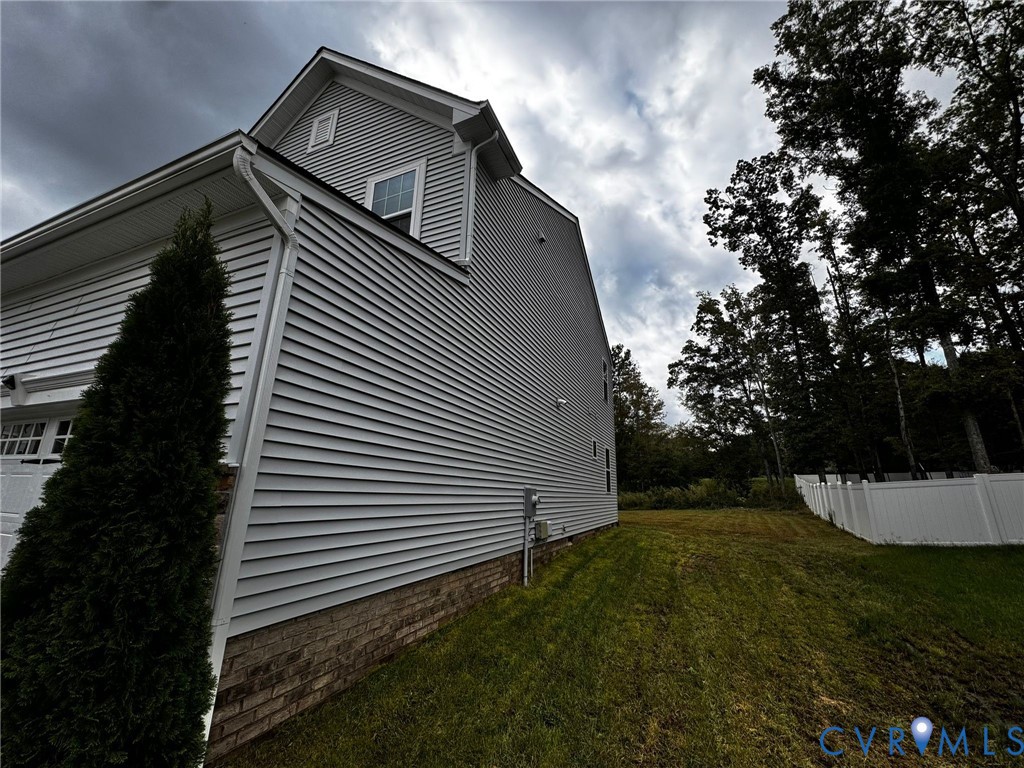 16043 Cambria Cove Boulevard Midlothian, VA 23112 - Photo 32 of 44 a view of a house with a yard