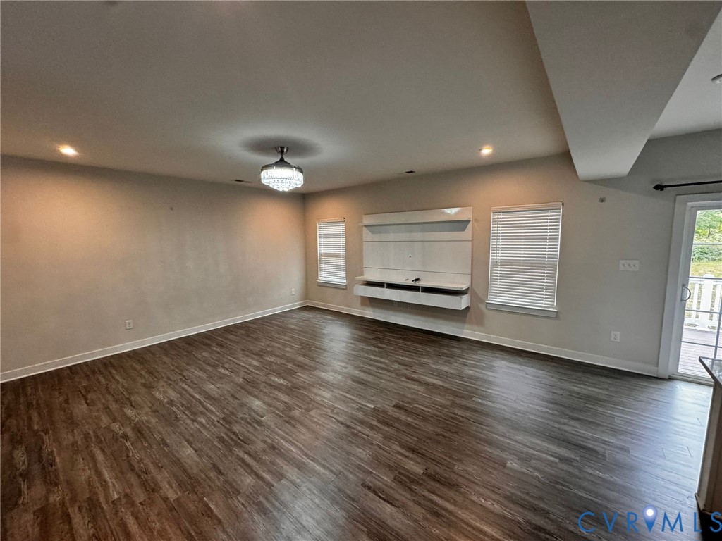 16043 Cambria Cove Boulevard Midlothian, VA 23112 - Photo 33 of 44 an empty room with wooden floor and windows