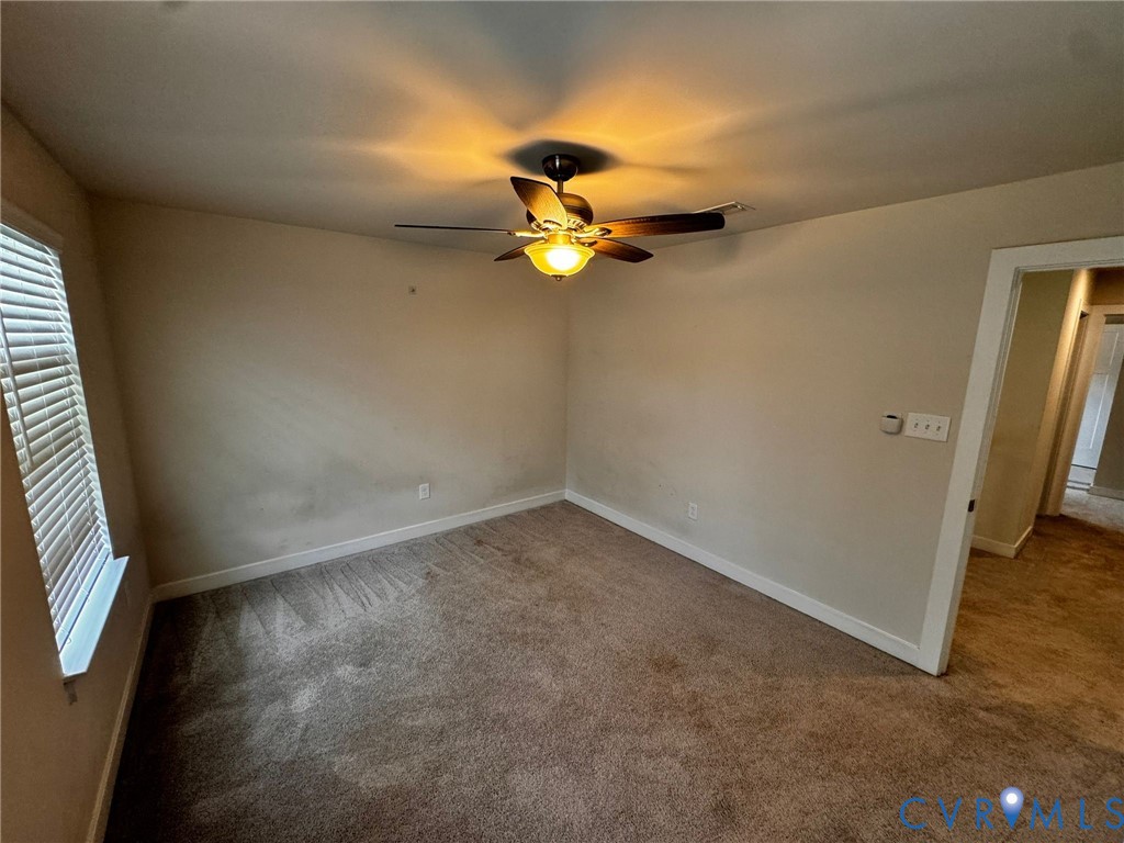 16043 Cambria Cove Boulevard Midlothian, VA 23112 - Photo 36 of 44 an empty room and chandelier fan