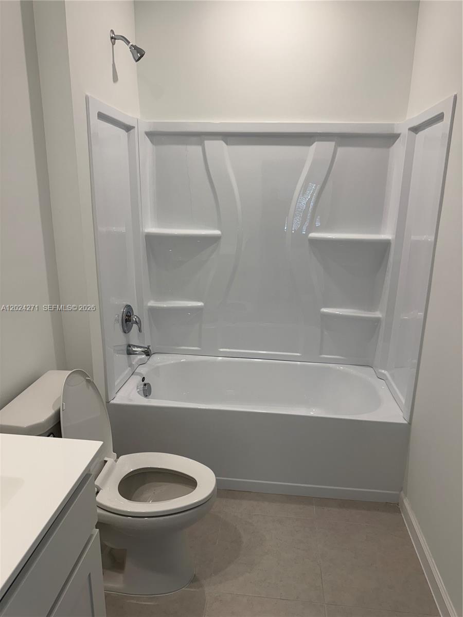 693 Carlyle Way Fort Pierce, FL 34947 - Photo 17 of 19 a bathroom with a sink and a vanity