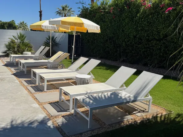 a view of yard with outdoor seating