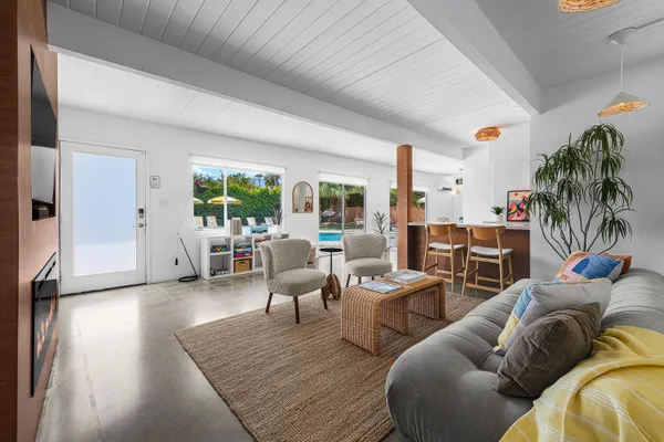 a living room with furniture and a large window