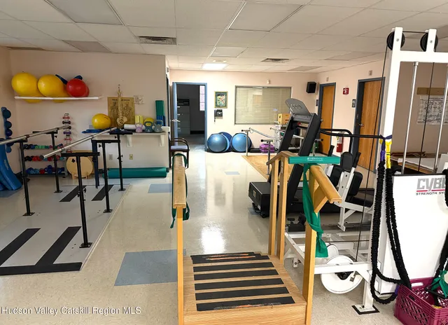 a living room with lots of furniture and a chandelier