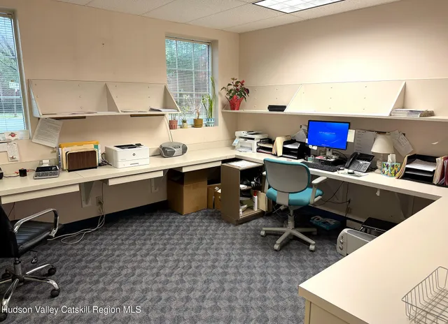 a view of a dining room with furniture and a table