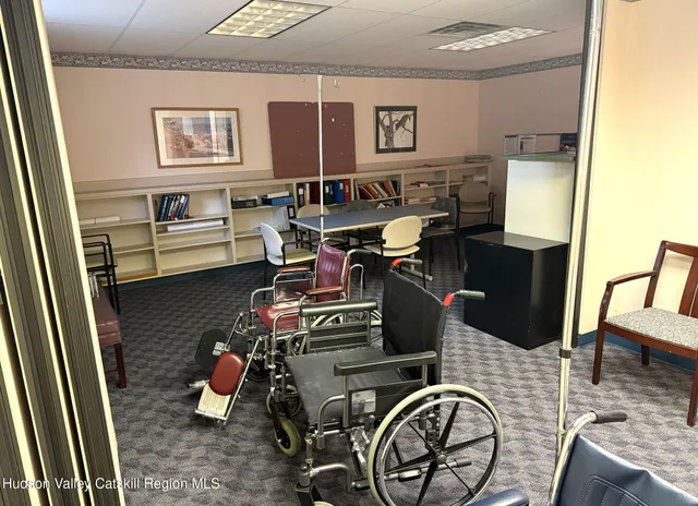 a hallway with a view of living room with furniture