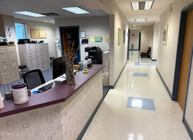 a kitchen with sink refrigerator and stove