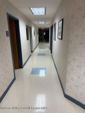 a view of a workspace with furniture