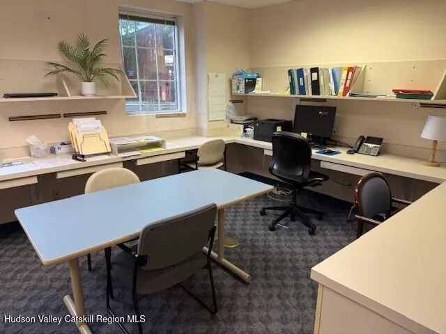 a view of kitchen with furniture and wooden floor