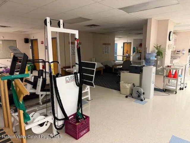 a view of a livingroom with furniture and a window