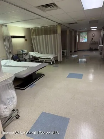 a kitchen with a sink a stove a refrigerator and cabinets