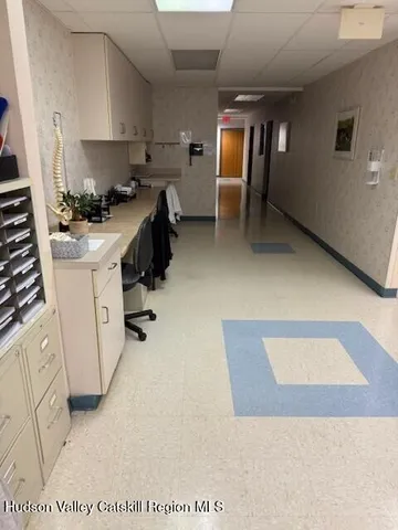 a lobby with furniture and window