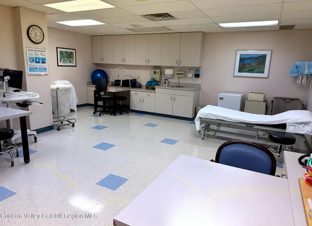 a bedroom with a bed and a desk