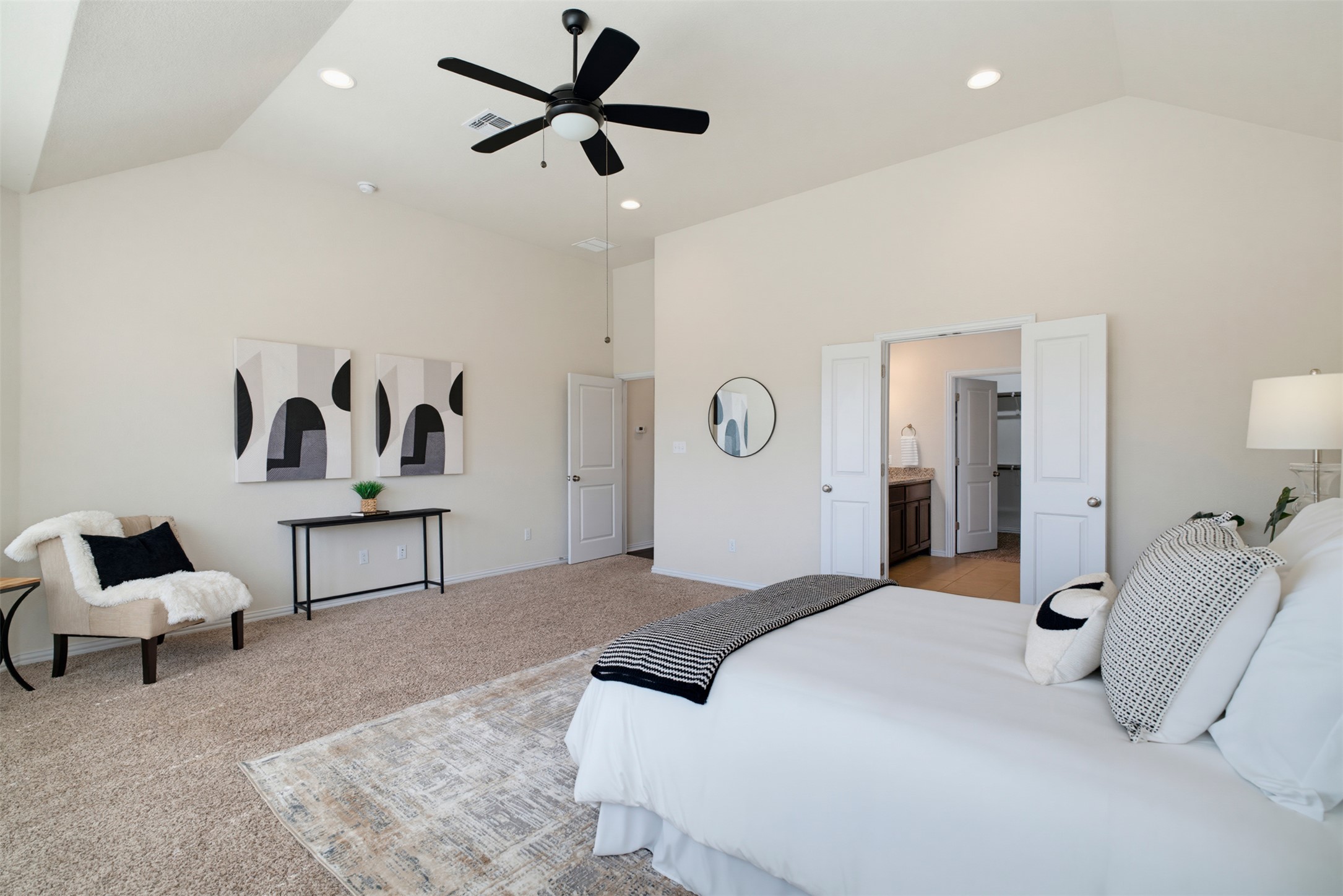 12613 Twisted Root Drive Manchaca, TX 78652 - Photo 11 of 33 Lofty ceilings and plush carpeting define this spacious and serene bedroom.