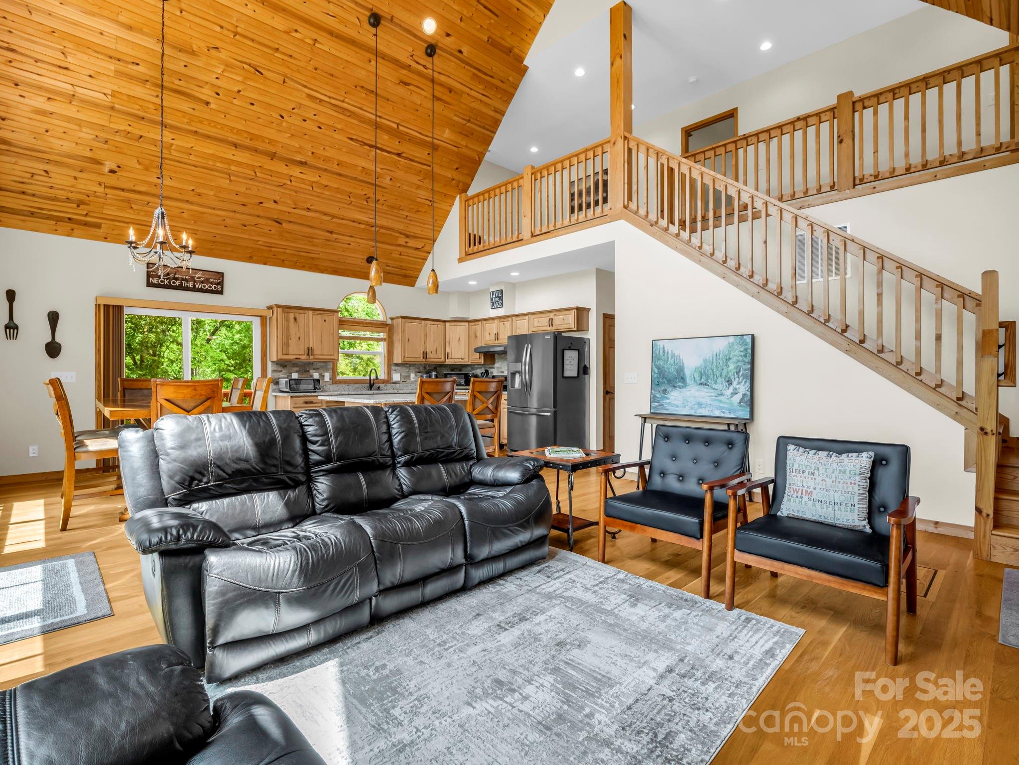 188 Fern Loop Lake Lure, NC 28746 - Photo 13 of 48 a living room with furniture and a rug