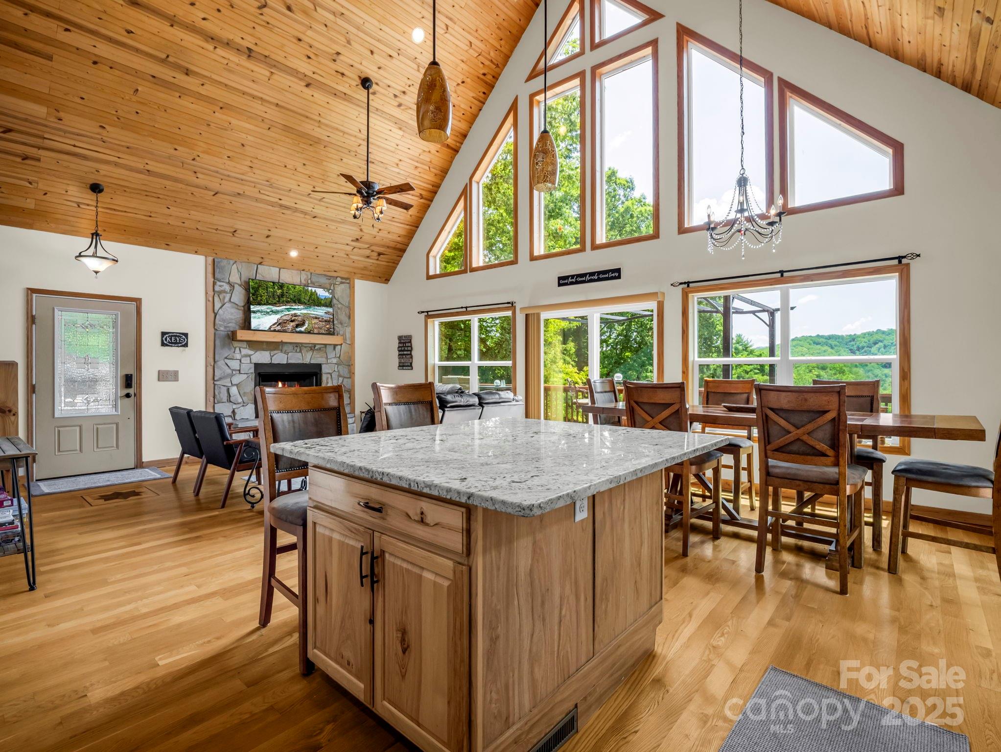 188 Fern Loop Lake Lure, NC 28746 - Photo 18 of 48 a kitchen with a table chairs and wooden floor