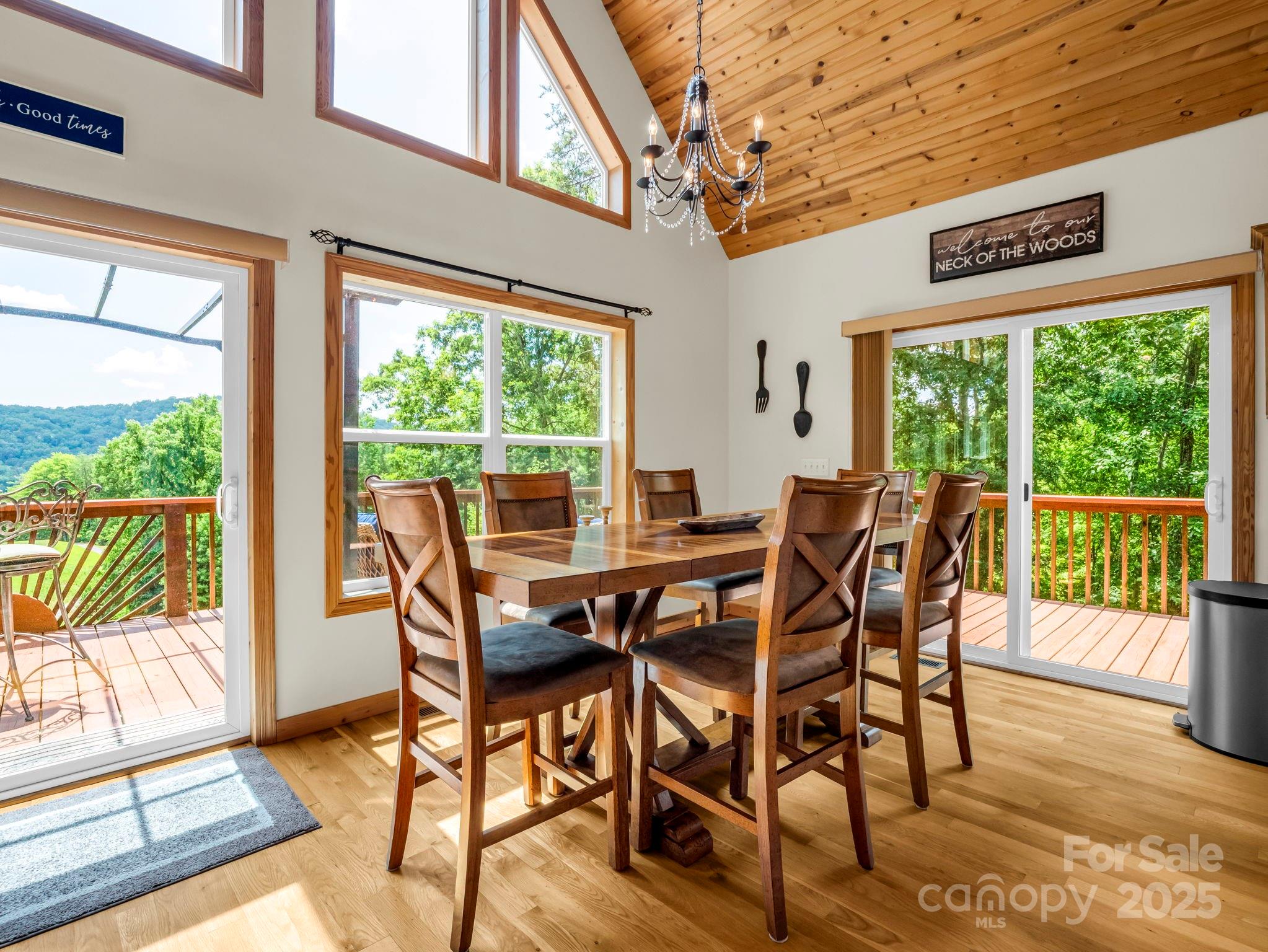 188 Fern Loop Lake Lure, NC 28746 - Photo 19 of 48 a view of a dining room with furniture window and outside view