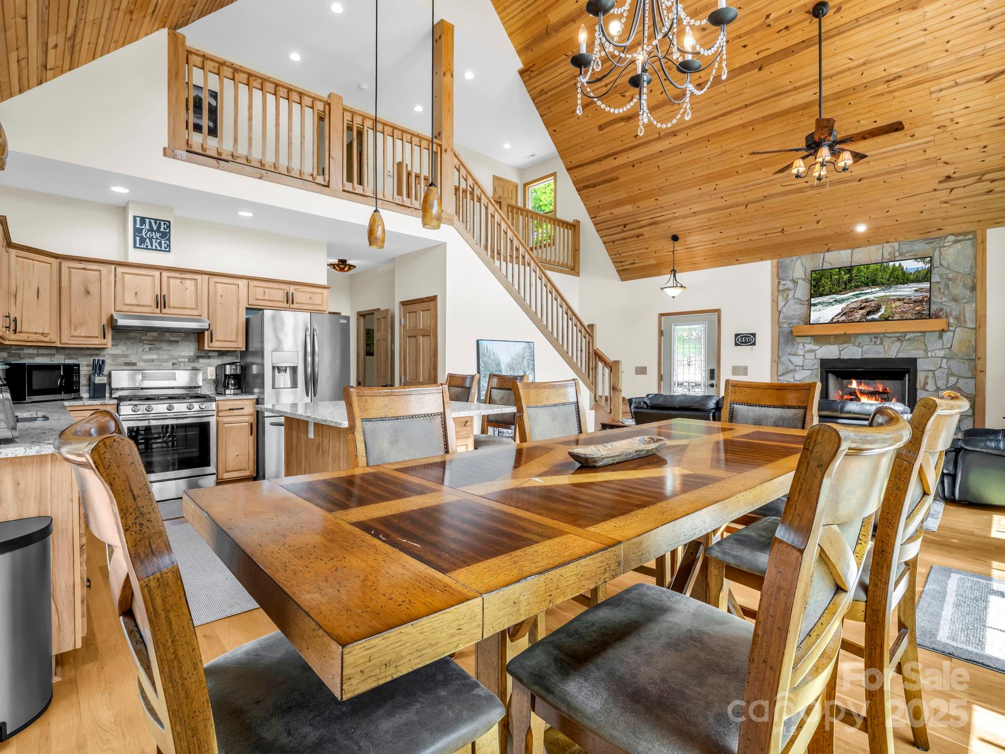 188 Fern Loop Lake Lure, NC 28746 - Photo 20 of 48 a living room with stainless steel appliances kitchen island granite countertop furniture and a kitchen view