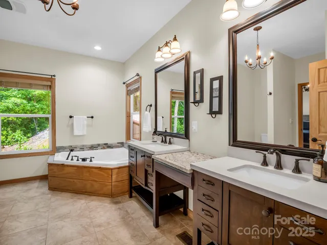 a spacious bathroom with a double vanity sink mirror and double