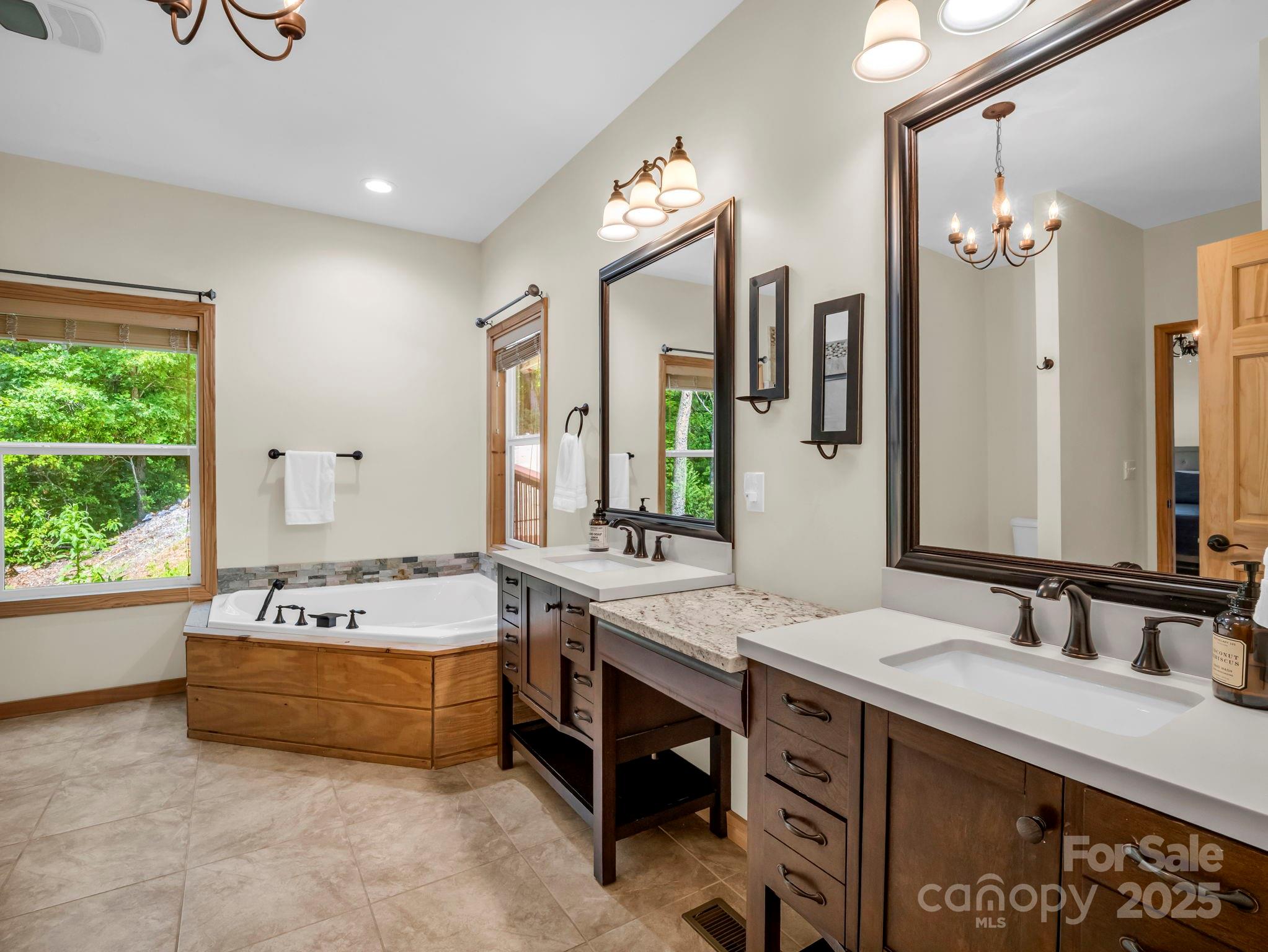 188 Fern Loop Lake Lure, NC 28746 - Photo 25 of 48 a spacious bathroom with a double vanity sink mirror and double
