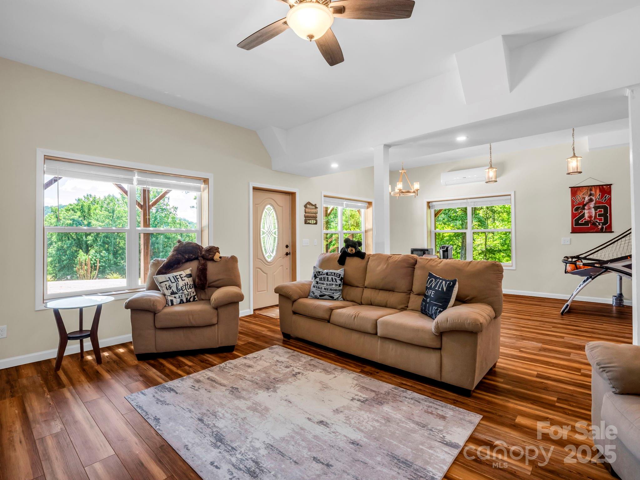 188 Fern Loop Lake Lure, NC 28746 - Photo 33 of 48 a living room with furniture and a large window