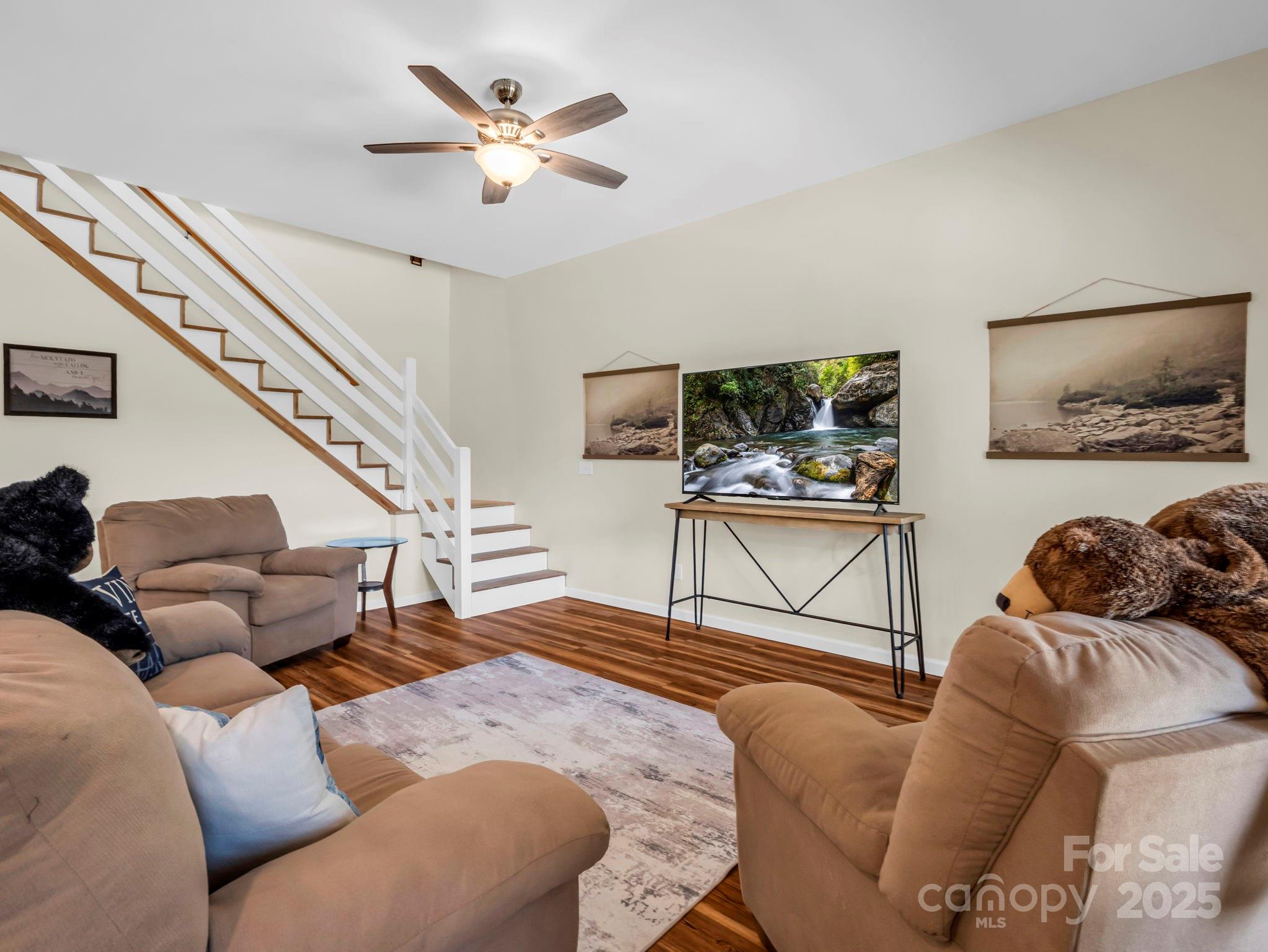 188 Fern Loop Lake Lure, NC 28746 - Photo 34 of 48 a living room with furniture and a flat screen tv