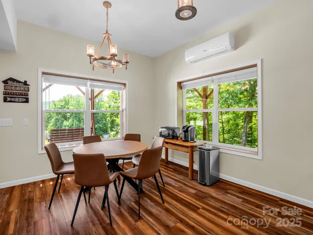 a view of a dining room with furniture window and outside view