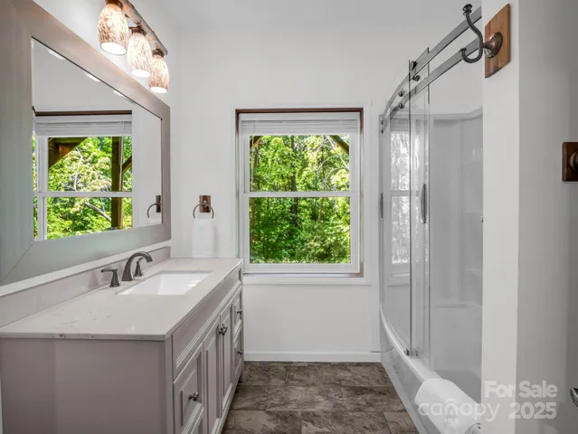 a bathroom with a sink and a large mirror