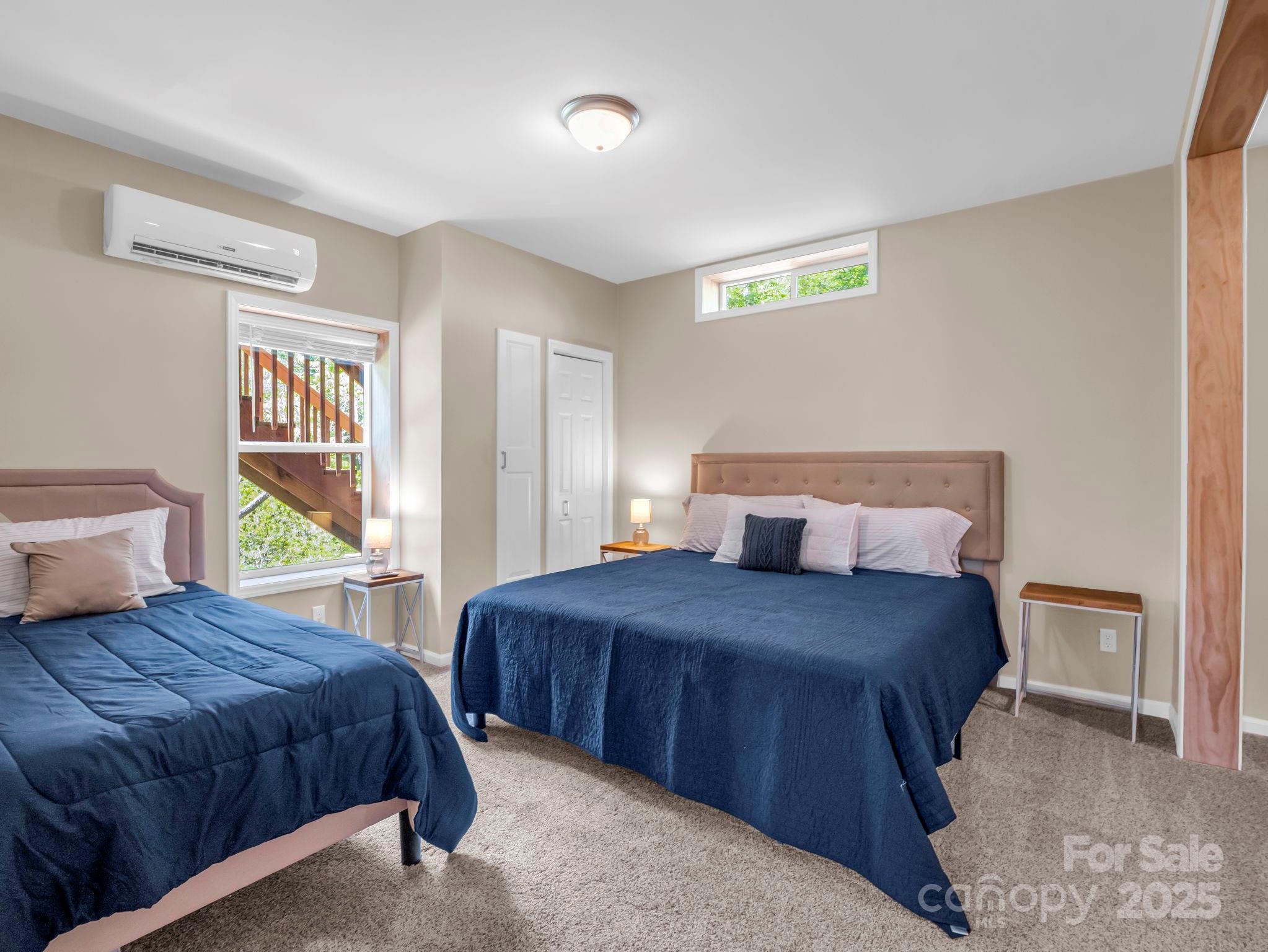 188 Fern Loop Lake Lure, NC 28746 - Photo 39 of 48 a bedroom with a bed and a painting on the wall