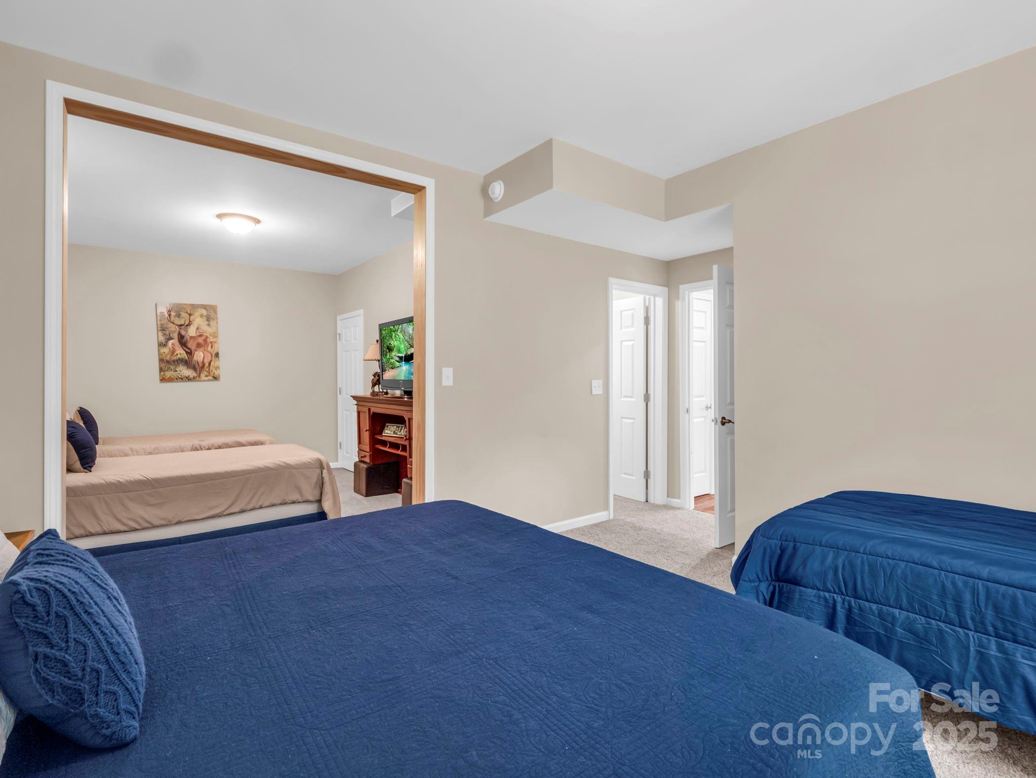 188 Fern Loop Lake Lure, NC 28746 - Photo 40 of 48 a bedroom with a bed and a couch