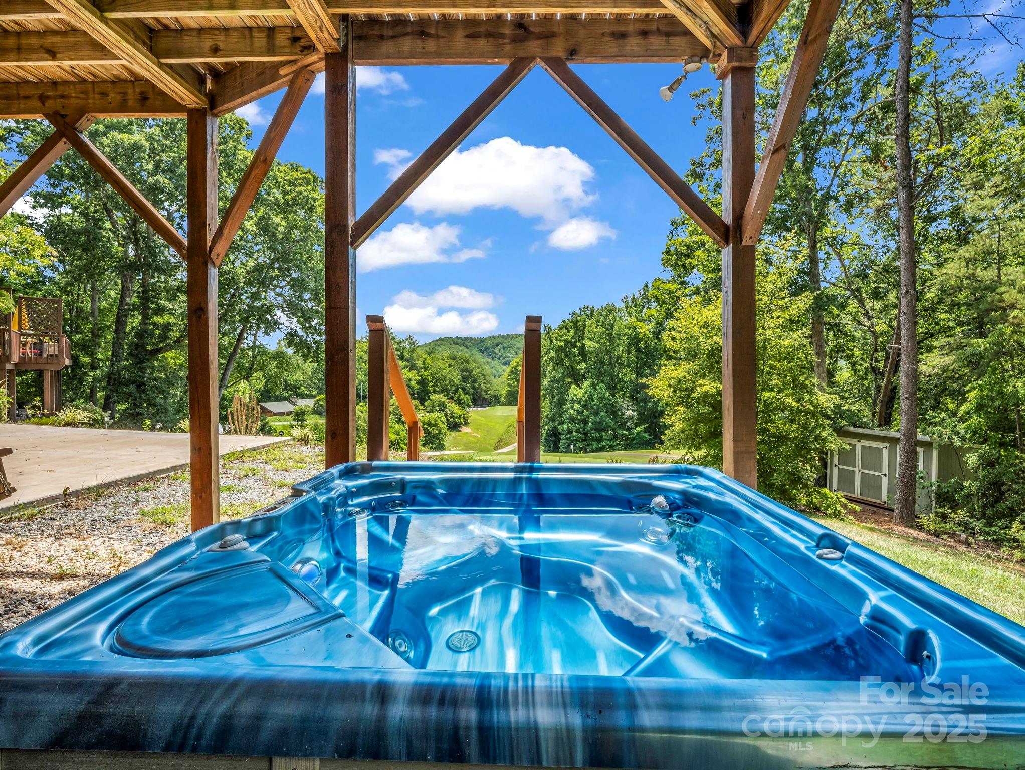 188 Fern Loop Lake Lure, NC 28746 - Photo 5 of 48 a view of swimming pool from a balcony