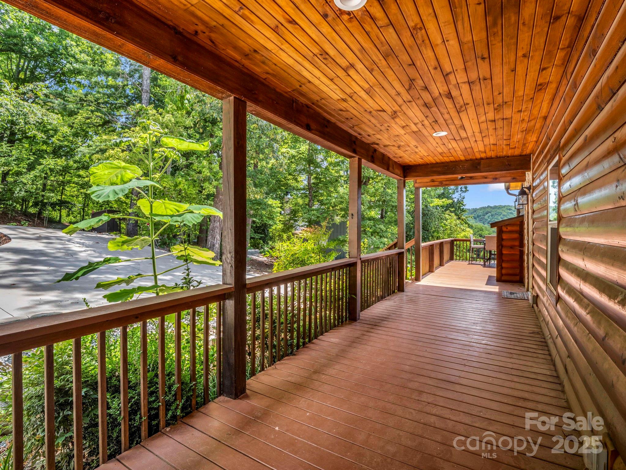 188 Fern Loop Lake Lure, NC 28746 - Photo 6 of 48 a view of balcony with wooden floor