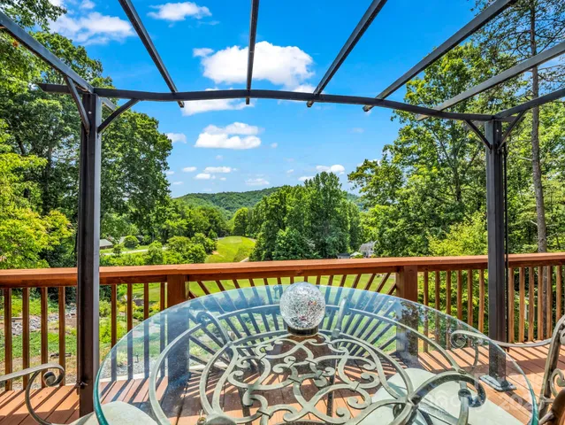 a view of a chair and table in the balcony