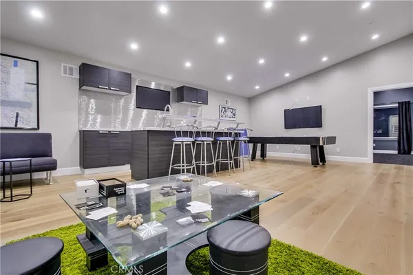 a kitchen with a table and chairs in it