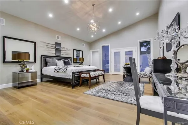 a bedroom with a bed and furniture